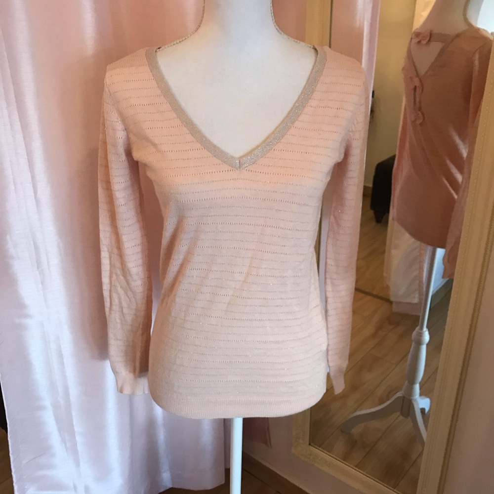 Blush sweater with bows along the back